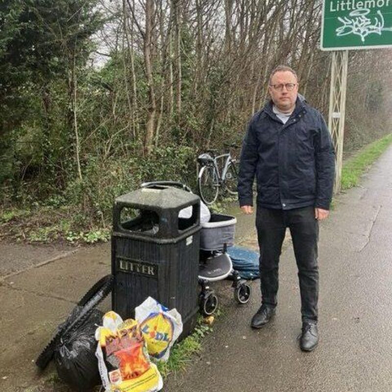 Cllr Ed Turner in front of dumped rubbish on the ring road cyclepath near Rose Hill. 