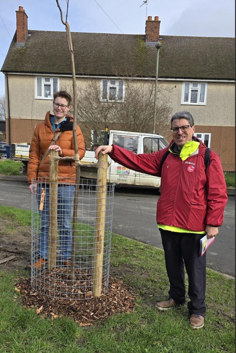Parish Councillor Anna Railton and Littlemore City Councillor Tiago Corais pictured by one of 26 new trees in Littlemore